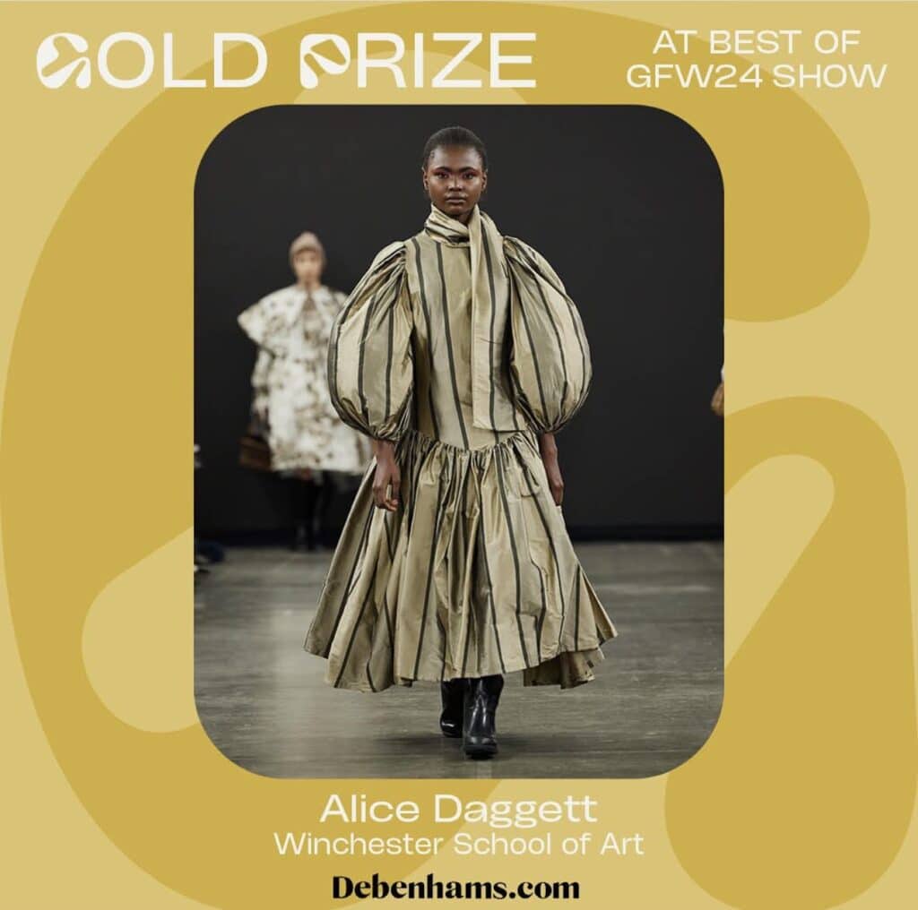 A model walks the runway wearing a voluminous, striped dress with puffed sleeves. Text reads, "Gold Prize at Best of GFW24 Show" and "Alice Daggett, Winchester School of Art."