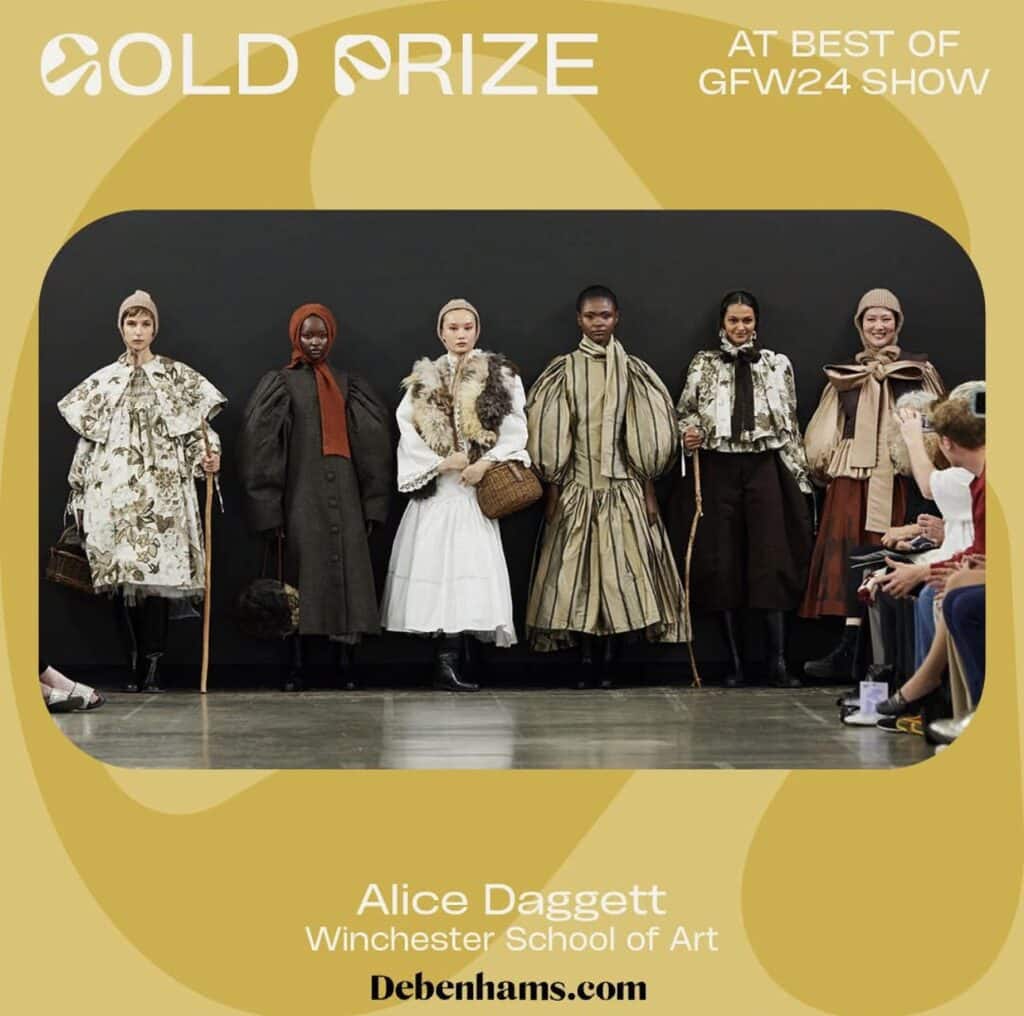 Six models in elaborate, structured fashion designs stand in a row on a runway, holding handbags. The text reads "Gold Prize at Best of GFW24 Show," with credits to Alice Daggett from Winchester School of Art. Explore our online fashion courses to master skills like these.