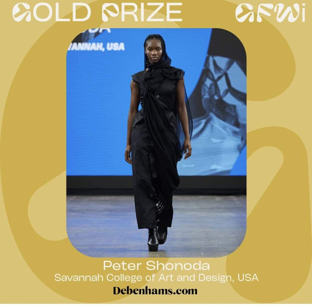 A model walks the runway wearing a black outfit at a fashion show. The backdrop reads "Gold Prize Graduate Fashion Week 2024", "Savannah, USA". Text below reads "Peter Shonoda, Savannah College of Art and Design, USA".