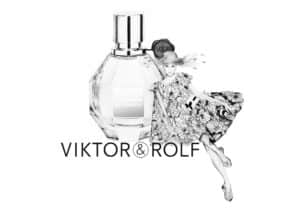 Black and white image featuring a bottle of Viktor & Rolf Flowerbomb perfume with a stylised drawing of a woman in a floral dress next to it. The brand name "VIKTOR&ROLF" is displayed below.