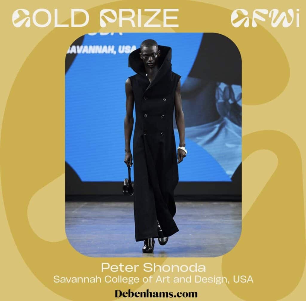 A person wearing a black outfit walks down a runway. The caption reads: "GOLD PRIZE Graduate Fashion Week 2024. Peter Shonoda, Savannah College of Art and Design, USA. Debenhams.co.uk.