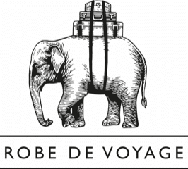 Black and white illustration of an elephant carrying a stack of suitcases on its back, with the text “ROBE DE VOYAGE” written below.